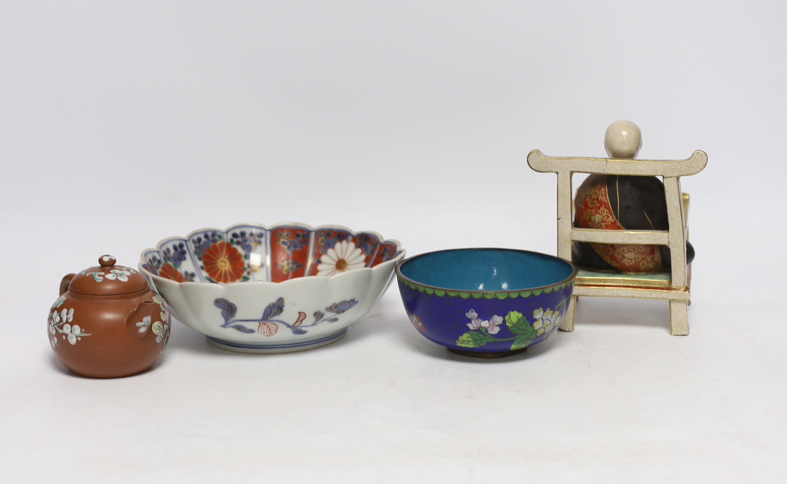 A Chinese enamelled yixing teapot and cloisonné bowl together with a Japanese Imari bowl and a Satsuma seated figure of a Buddhist monk, tallest 14cm